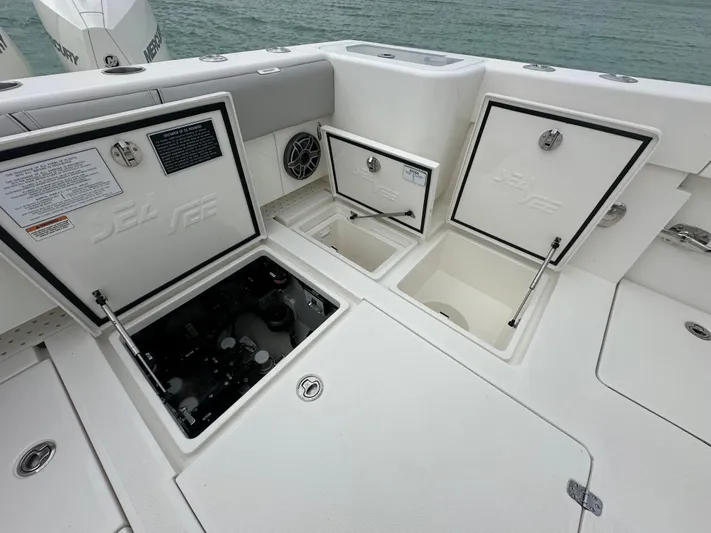  Yacht Photos Pics 2024 SeaVee 322z boat storage compartments open on deck.