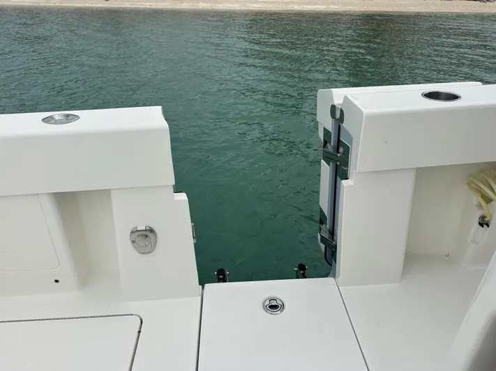  Yacht Photos Pics 2024 SeaVee 322z boat stern view with open transom door.