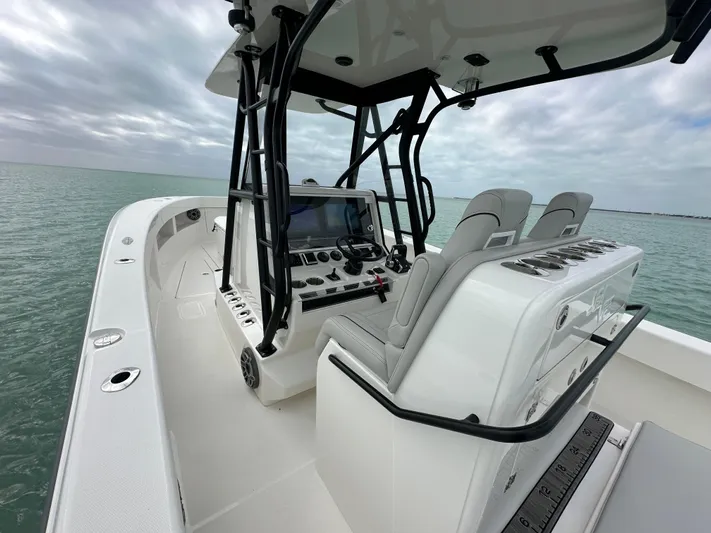  Yacht Photos Pics 2024 SeaVee 322z boat interior with modern console and seating on open water.