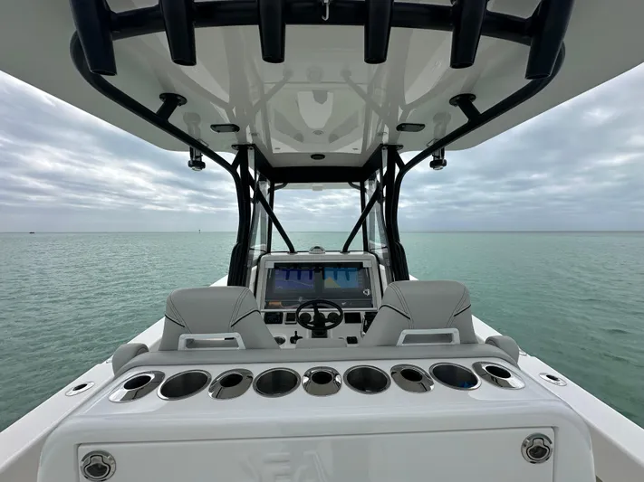  Yacht Photos Pics 2024 SeaVee 322z boat dashboard with ocean view and modern controls.