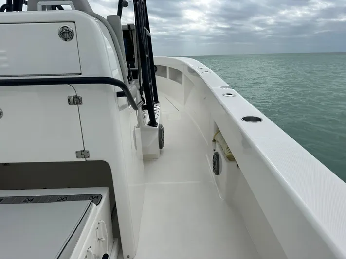  Yacht Photos Pics 2024 SeaVee 322z boat deck with ocean view under cloudy sky.