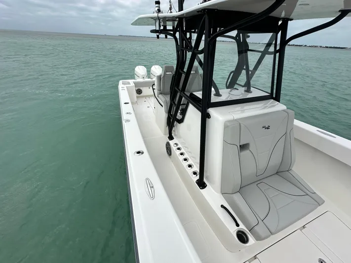  Yacht Photos Pics 2024 SeaVee 322z boat on calm ocean waters, showcasing sleek design and modern features.