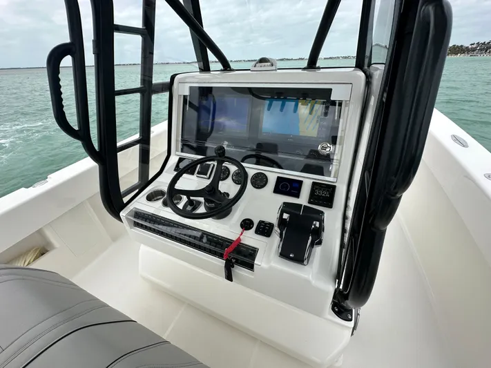  Yacht Photos Pics 2024 SeaVee 322z boat console with advanced navigation system on open water.