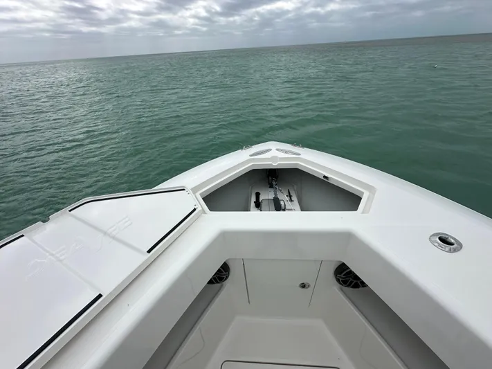  Yacht Photos Pics 2024 SeaVee 322z boat bow on open water under cloudy sky.