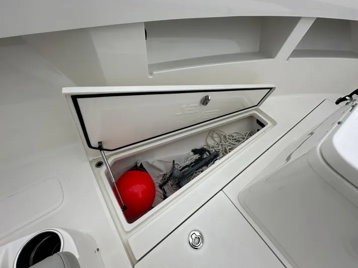  Yacht Photos Pics 2024 SeaVee 322z boat storage compartment with red buoy and ropes.