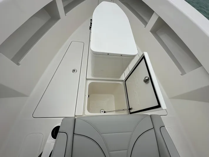  Yacht Photos Pics 2024 SeaVee 322z boat interior with open storage compartments and seating.