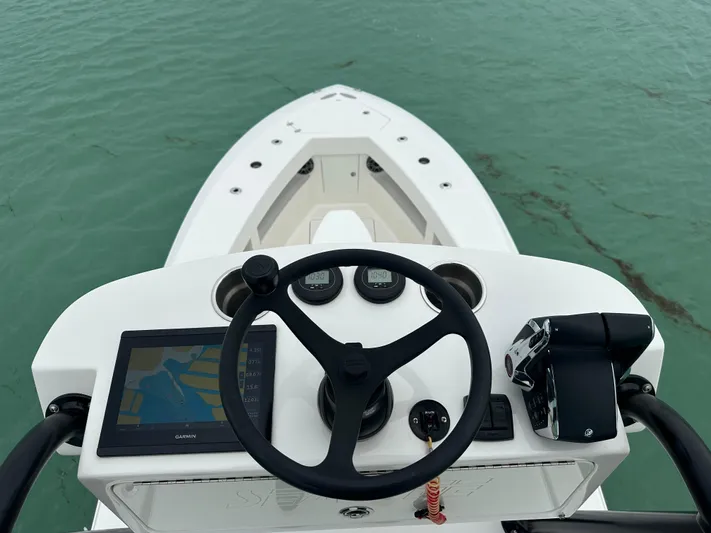  Yacht Photos Pics 2024 SeaVee 322z boat helm with navigation system on calm water.