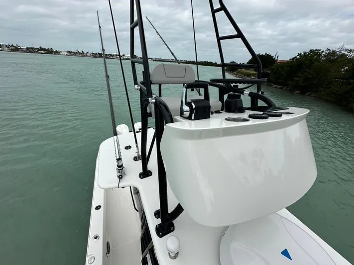  Yacht Photos Pics 2024 SeaVee 322z boat on water, featuring sleek design and modern controls.