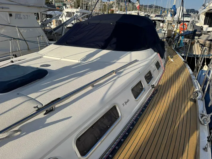  Yacht Photos Pics 2004 X-Yachts X 46 sailboat docked, featuring sleek design and wooden deck.