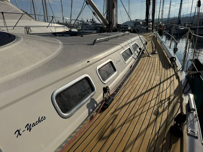  Yacht Photos Pics 2004 X-Yachts X 46 sailboat deck with wooden finish, docked in a marina.