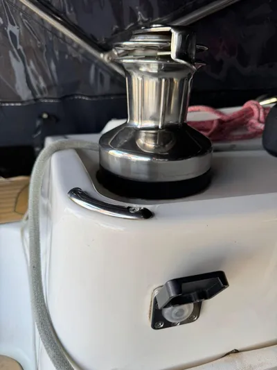  Yacht Photos Pics Winch on 2004 X-Yachts X 46 sailboat, featuring polished metal and rope detail.