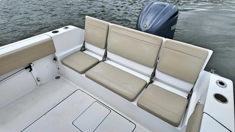  Yacht Photos Pics 2022 Release 240RX boat with beige seating and Yamaha outboard motor.