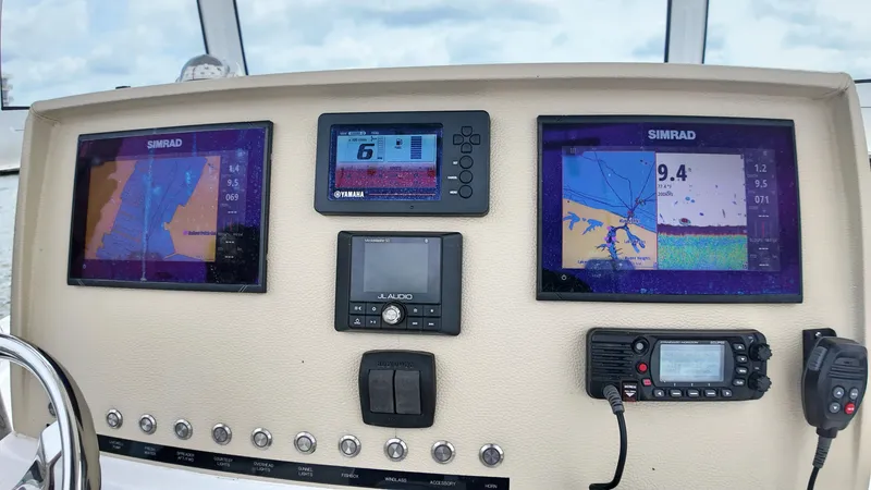  Yacht Photos Pics Boat dashboard with Simrad displays and Yamaha controls on a 2022 Release 240RX.