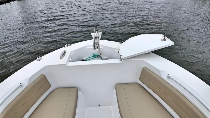  Yacht Photos Pics Bow seating area of 2022 Release 240RX boat with open anchor compartment.