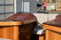 2024 Custom Bowrider interior with polished wood finish and quilted seating.