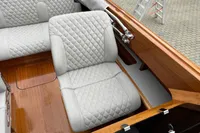 2024 Custom Bowrider interior with quilted seats and wooden accents.