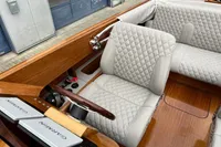 Luxurious 2024 Custom Bowrider interior with quilted seats and Garmin navigation system.