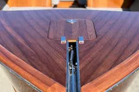 2024 Custom Bowrider boat with sleek wooden deck and polished metal accents.