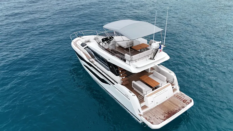 Prestige F4.9 Yacht Photos Pics Luxury Prestige F4 yacht cruising on clear blue ocean waters, 2025 model.