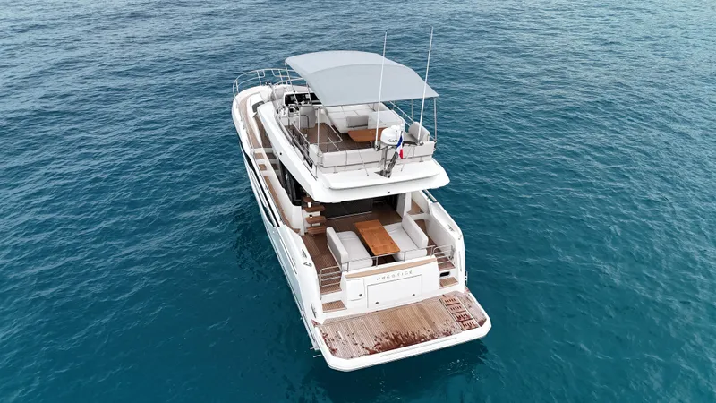 Prestige F4.9 Yacht Photos Pics Luxury Prestige F4 yacht, 2025 model, cruising on clear blue ocean waters.
