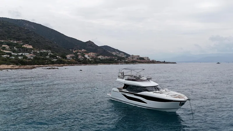 Prestige F4.9 Yacht Photos Pics Luxury Prestige F4 yacht cruising near scenic coastline, 2025 model.