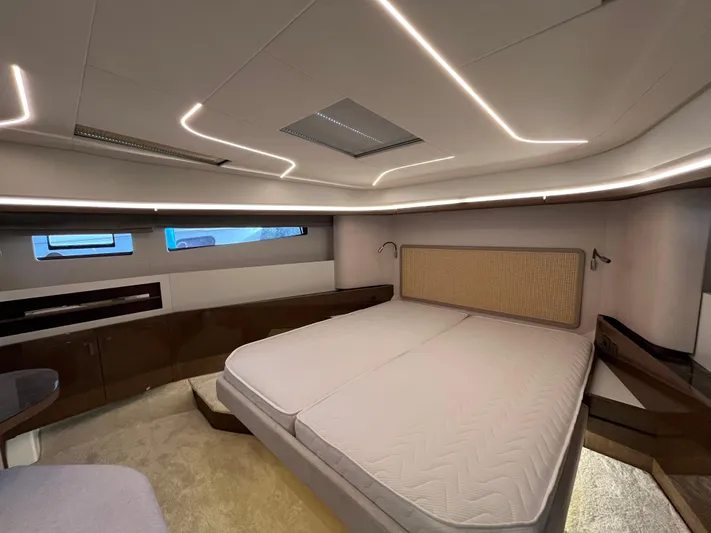 Prestige F4.9 Yacht Photos Pics Luxurious interior of 2025 Prestige F4 yacht with modern lighting and spacious bed.