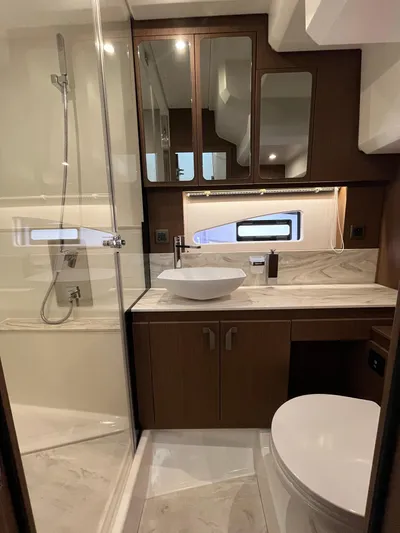 Prestige F4.9 Yacht Photos Pics Luxurious bathroom in 2025 Prestige F4 yacht with modern fixtures and elegant design.