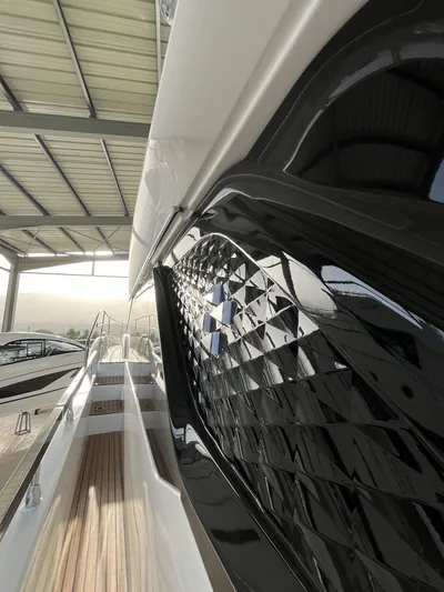 Prestige F4.9 Yacht Photos Pics 2025 Prestige F4 yacht with sleek design and modern detailing in a covered marina.