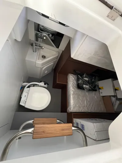 Prestige F4.9 Yacht Photos Pics Compact bathroom and storage area in 2025 Prestige F4 boat.