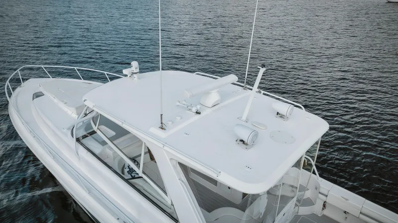  Yacht Photos Pics 2018 Intrepid 475 Sport Yacht on water, aerial view.