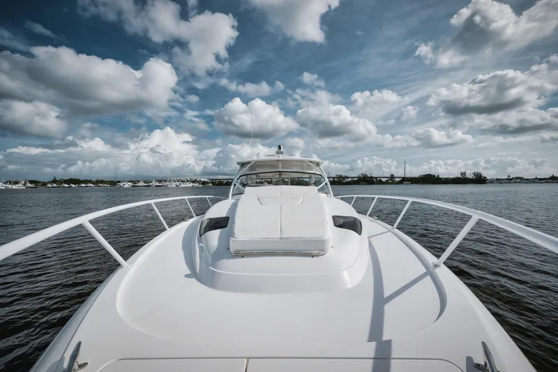  Yacht Photos Pics 2018 Intrepid 475 Sport Yacht on water under cloudy sky.