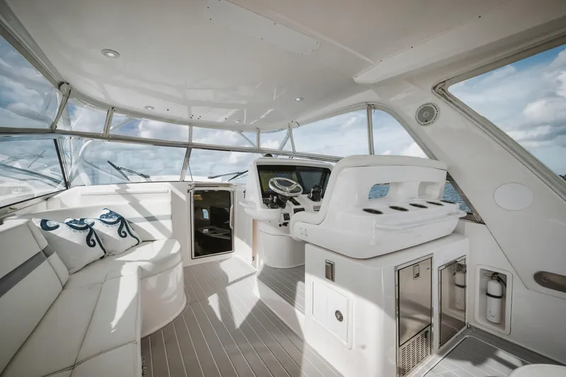  Yacht Photos Pics 2018 Intrepid 475 Sport Yacht interior with sleek white seating and modern helm.