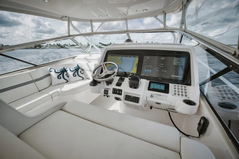  Yacht Photos Pics 2018 Intrepid 475 Sport Yacht cockpit with modern navigation systems and luxurious seating.