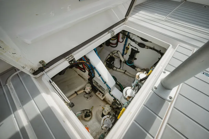  Yacht Photos Pics Engine compartment of 2018 Intrepid 475 Sport Yacht, showcasing mechanical components and wiring.