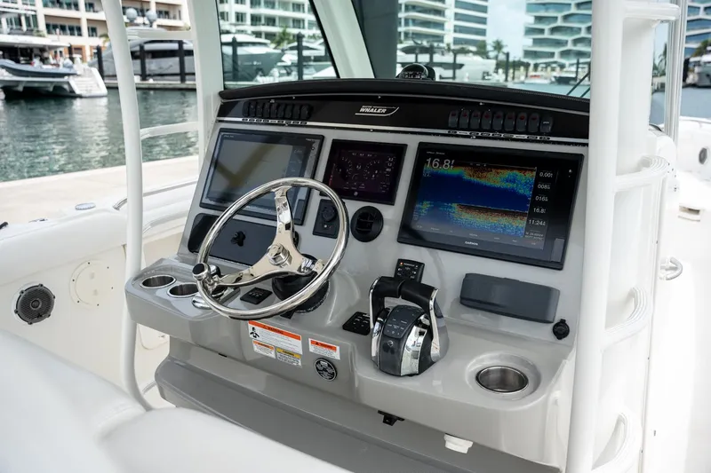  Yacht Photos Pics 2014 Boston Whaler 350 Outrage helm with advanced navigation displays and controls.