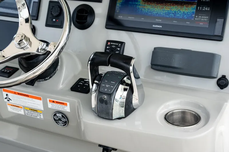  Yacht Photos Pics Control panel of 2014 Boston Whaler 350 Outrage with steering wheel and throttle.