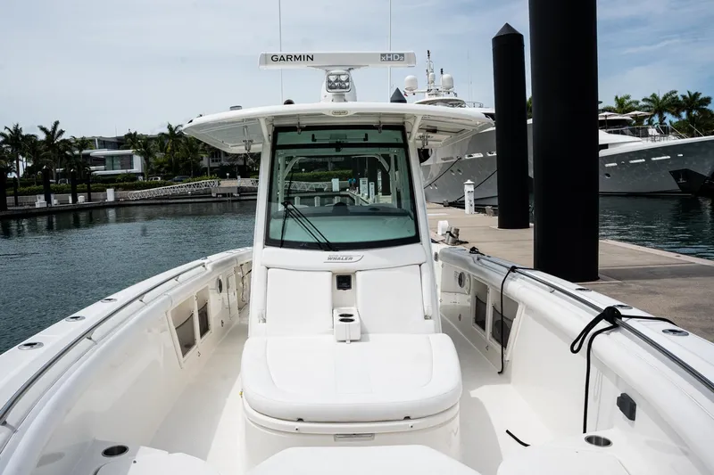  Yacht Photos Pics 2014 Boston Whaler 350 Outrage boat docked at marina, featuring Garmin equipment.