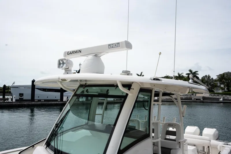  Yacht Photos Pics Boston Whaler 350 Outrage 2014 with Garmin radar, docked in a marina.