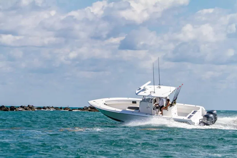  Yacht Photos Pics Contender 32 ST 2025 model boat cruising on open water.