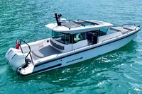 2020 Axopar 37 Cross Cabin boat on clear blue water, featuring multi-storage and JPO joystick.