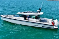 2020 Axopar 37 Cross Cabin boat on clear blue water.