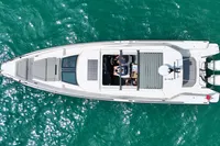 Overhead view of 2020 Axopar 37 Cross Cabin on turquoise water.