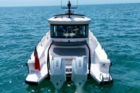 Axopar 37 Cross Cabin boat on open sea, rear view, 2020 model.