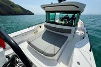 2020 Axopar 37 Cross Cabin boat with multi-storage, JPO joystick, on calm sea.
