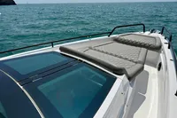 2020 Axopar 37 Cross Cabin boat with sunbed, cruising on open sea.