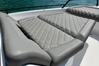 Luxurious gray seating on 2020 Axopar 37 Cross Cabin boat, overlooking water.