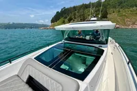 2020 Axopar 37 Cross Cabin boat on water, featuring multi-storage and JPO joystick.