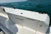 Axopar 37 Cross Cabin 2020 boat with multi-storage, ocean view in background.