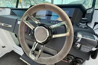 Steering wheel of 2020 Axopar 37 Cross Cabin with navigation controls.