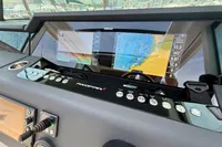 2020 Axopar 37 Cross Cabin dashboard with navigation screens and controls.